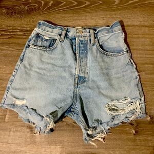 AGOLDE Riley high-rise button fly cut-off denim shorts.